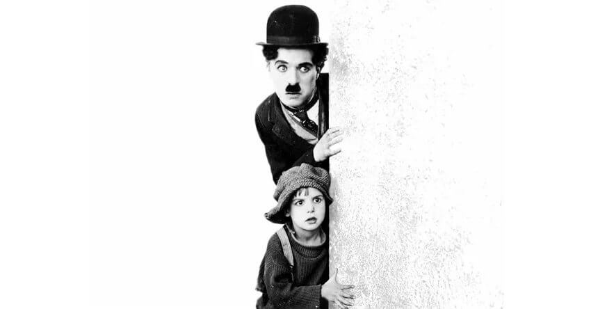 Charlie Chaplin and Jackie Coogan in The Kid, 1921